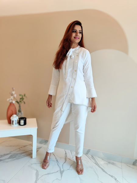 WHITE ASYMMETRIC LONG JACKET PAIRED WITH FITTED PANTS
