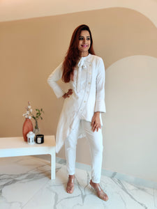 WHITE ASYMMETRIC LONG JACKET PAIRED WITH FITTED PANTS