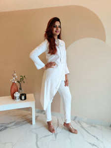 WHITE ASYMMETRIC LONG JACKET PAIRED WITH FITTED PANTS