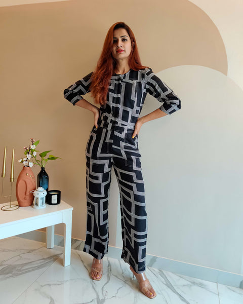 BLACK GEOMETRIC PRINT FRONT ZIP JUMPSUIT