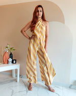 Load image into Gallery viewer, YELLOW PRINTED STRIPES HALTER NECK FLARED JUMPSUIT
