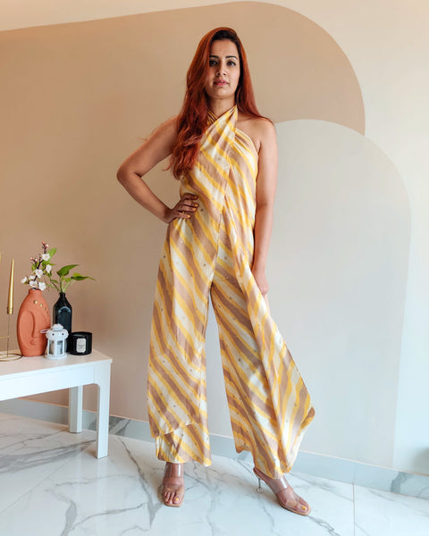 YELLOW PRINTED STRIPES HALTER NECK FLARED JUMPSUIT
