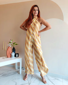 YELLOW PRINTED STRIPES HALTER NECK FLARED JUMPSUIT