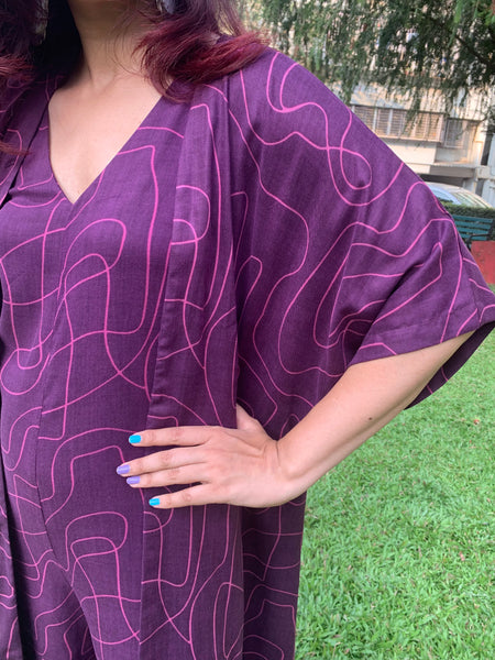 PURPLE WAVE PRINT JUMPSUIT WITH SLEEVED JACKET