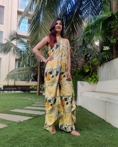YELLOW BLUE ABSTRACT HALTER NECK FLARED DRAPE JUMPSUIT