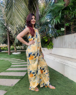 Load image into Gallery viewer, YELLOW BLUE ABSTRACT HALTER NECK FLARED DRAPE JUMPSUIT
