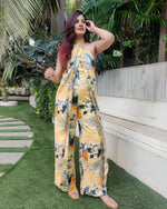 Load image into Gallery viewer, YELLOW BLUE ABSTRACT HALTER NECK FLARED DRAPE JUMPSUIT
