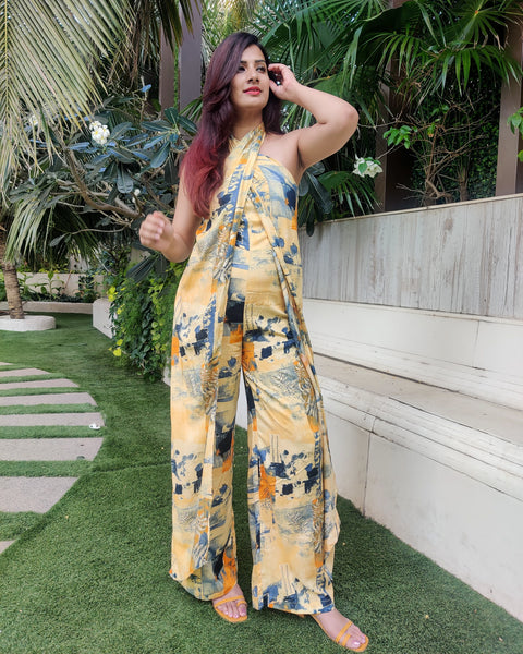 YELLOW BLUE ABSTRACT HALTER NECK FLARED DRAPE JUMPSUIT