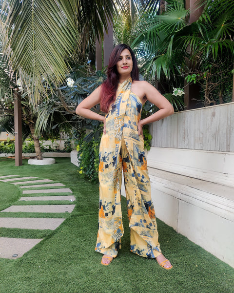 YELLOW BLUE ABSTRACT HALTER NECK FLARED DRAPE JUMPSUIT