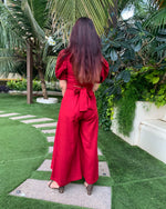 Load image into Gallery viewer, RED PUFFED SLEEVES TOP WITH TIE UP DETAIL PAIRED WITH FLARED PANTS
