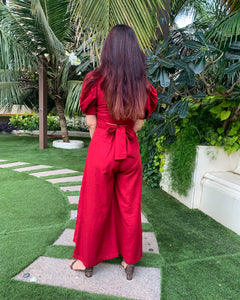 RED PUFFED SLEEVES TOP WITH TIE UP DETAIL PAIRED WITH FLARED PANTS