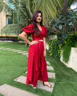 Load image into Gallery viewer, RED PUFFED SLEEVES TOP WITH TIE UP DETAIL PAIRED WITH FLARED PANTS
