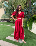 Load image into Gallery viewer, RED PUFFED SLEEVES TOP WITH TIE UP DETAIL PAIRED WITH FLARED PANTS
