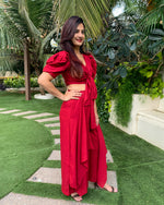 Load image into Gallery viewer, RED PUFFED SLEEVES TOP WITH TIE UP DETAIL PAIRED WITH FLARED PANTS
