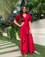 Load image into Gallery viewer, RED PUFFED SLEEVES TOP WITH TIE UP DETAIL PAIRED WITH FLARED PANTS
