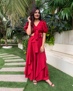 Load image into Gallery viewer, RED PUFFED SLEEVES TOP WITH TIE UP DETAIL PAIRED WITH FLARED PANTS
