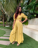 Load image into Gallery viewer, LIME YELLOW PUFFED SLEEVES TOP WITH TIE UP DETAIL PAIRED WITH FLARED PANTS
