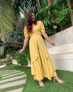 Load image into Gallery viewer, LIME YELLOW PUFFED SLEEVES TOP WITH TIE UP DETAIL PAIRED WITH FLARED PANTS
