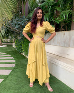 Load image into Gallery viewer, LIME YELLOW PUFFED SLEEVES TOP WITH TIE UP DETAIL PAIRED WITH FLARED PANTS
