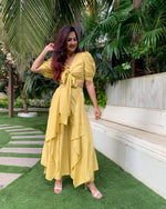 Load image into Gallery viewer, LIME YELLOW PUFFED SLEEVES TOP WITH TIE UP DETAIL PAIRED WITH FLARED PANTS
