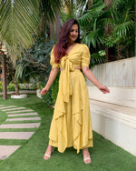 Load image into Gallery viewer, LIME YELLOW PUFFED SLEEVES TOP WITH TIE UP DETAIL PAIRED WITH FLARED PANTS
