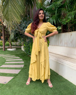 Load image into Gallery viewer, LIME YELLOW PUFFED SLEEVES TOP WITH TIE UP DETAIL PAIRED WITH FLARED PANTS
