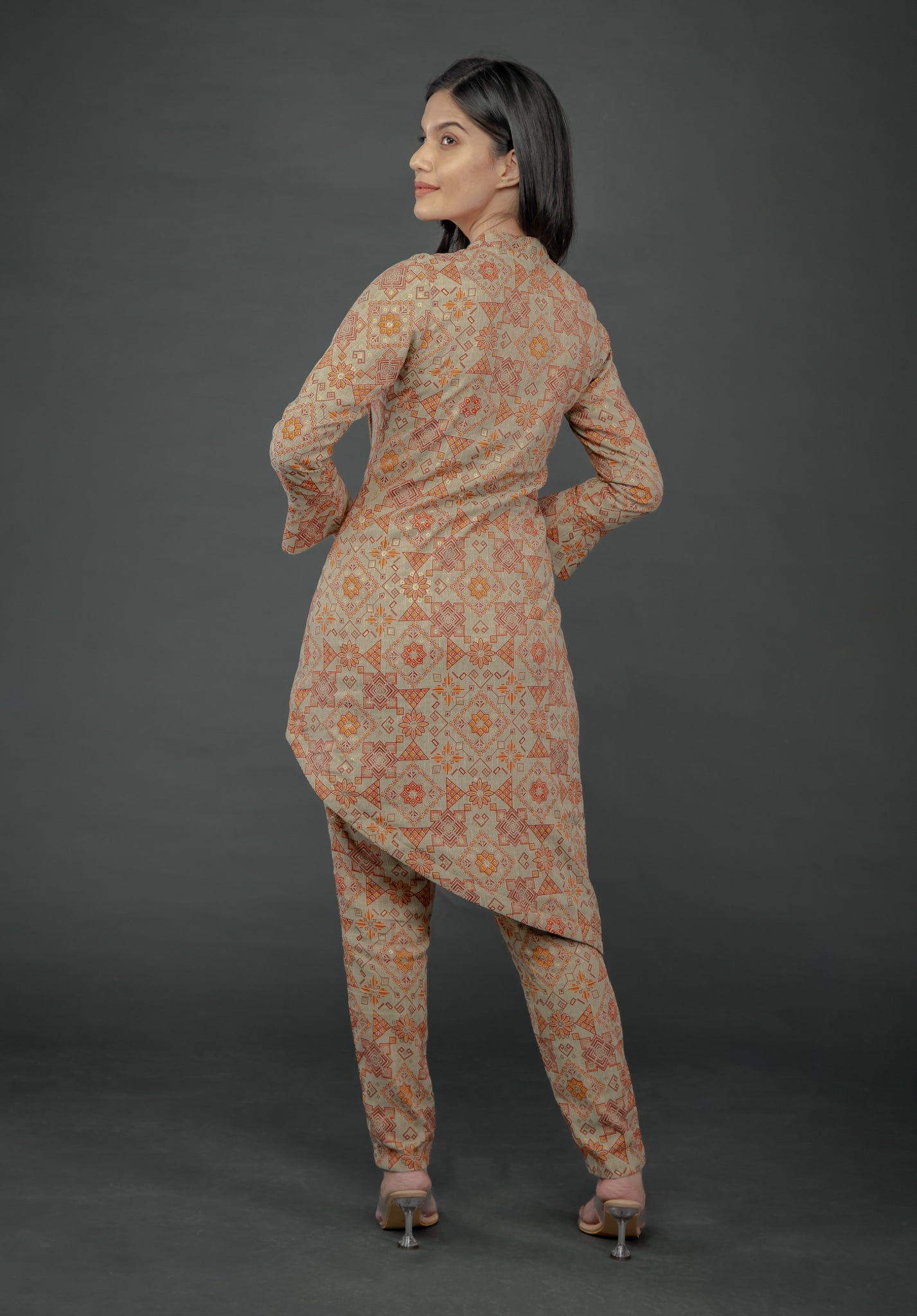 AZTEC ORANGE ASYMMETRIC LONG JACKET PAIRED WITH FITTED PANTS
