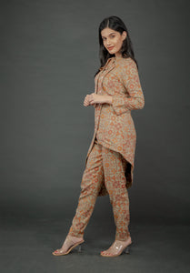 AZTEC ORANGE ASYMMETRIC LONG JACKET PAIRED WITH FITTED PANTS