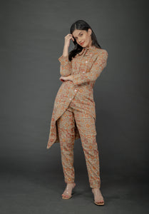 AZTEC ORANGE ASYMMETRIC LONG JACKET PAIRED WITH FITTED PANTS
