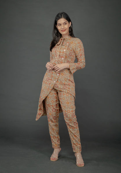 AZTEC ORANGE ASYMMETRIC LONG JACKET PAIRED WITH FITTED PANTS