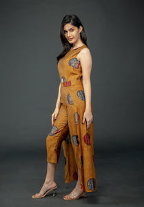 MUSTARD PRINTED SLEEVELESS JUMPSUIT WITH CAPE