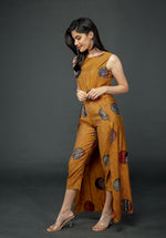 Load image into Gallery viewer, MUSTARD PRINTED SLEEVELESS JUMPSUIT WITH CAPE
