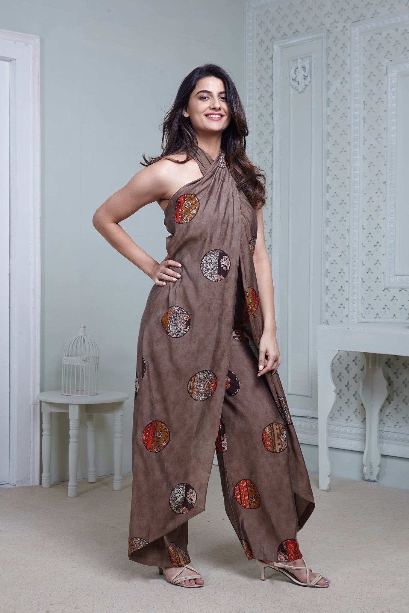 BROWN PRINTED HALTER NECK FLARED JUMPSUIT