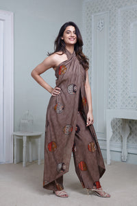 BROWN PRINTED HALTER NECK FLARED JUMPSUIT