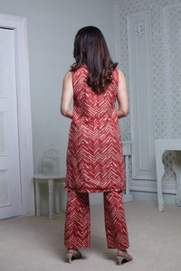 RED ZIGZAG SLEEVELESS LONG JACKET, HIPSTER PANT WITH BUSTIER