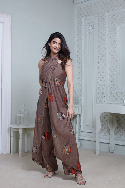 BROWN PRINTED HALTER NECK FLARED JUMPSUIT