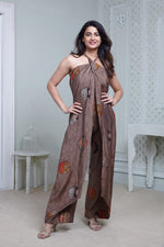 Load image into Gallery viewer, BROWN PRINTED HALTER NECK FLARED JUMPSUIT
