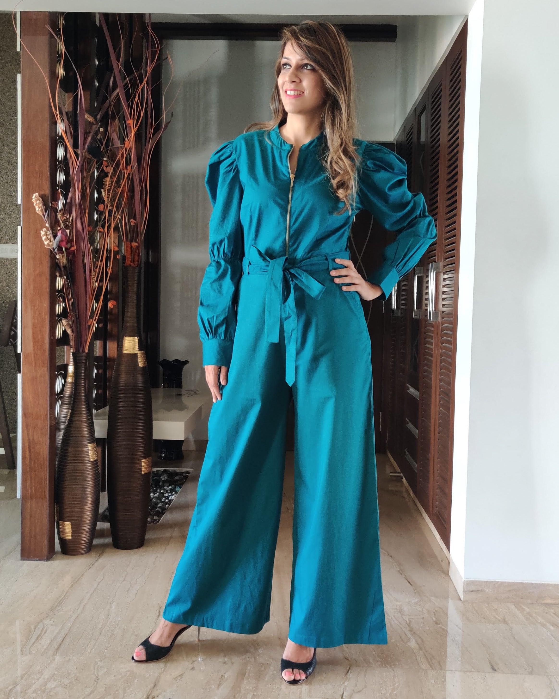 TEAL BLUE FRONT GOLDEN ZIP OPENING HIGH BAND COLLAR JUMPSUIT WITH PUFF SLEEVE & BELT