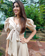 Load image into Gallery viewer, BEIGE PUFF SLEEVES FRONT TIEUP TOP PAIRED WITH FLARE PANTS
