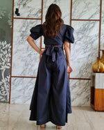 Load image into Gallery viewer, CHARCOAL BLACK PUFFED SLEEVES TOP WITH TIE UP DETAIL PAIRED WITH FLARED PANTS
