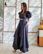 Load image into Gallery viewer, CHARCOAL BLACK PUFFED SLEEVES TOP WITH TIE UP DETAIL PAIRED WITH FLARED PANTS
