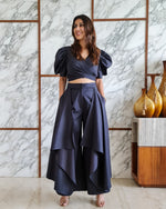 Load image into Gallery viewer, CHARCOAL BLACK PUFFED SLEEVES TOP WITH TIE UP DETAIL PAIRED WITH FLARED PANTS
