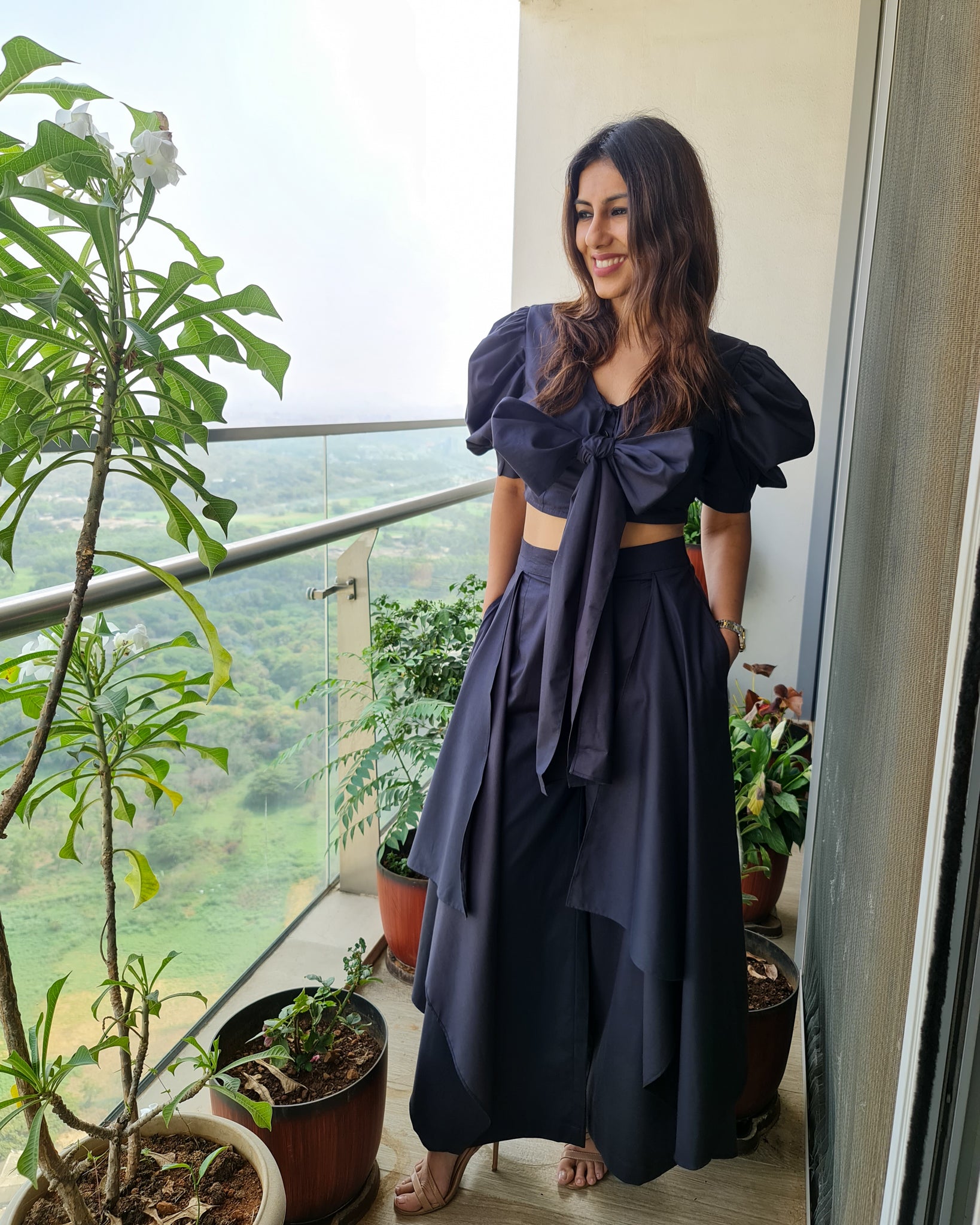 CHARCOAL BLACK PUFFED SLEEVES TOP WITH TIE UP DETAIL PAIRED WITH FLARED PANTS