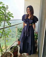Load image into Gallery viewer, CHARCOAL BLACK PUFFED SLEEVES TOP WITH TIE UP DETAIL PAIRED WITH FLARED PANTS
