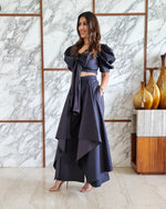 Load image into Gallery viewer, CHARCOAL BLACK PUFFED SLEEVES TOP WITH TIE UP DETAIL PAIRED WITH FLARED PANTS
