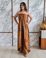 Load image into Gallery viewer, MUSTARD PRINTED HALTER NECK FLARED JUMPSUIT

