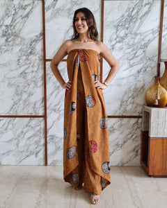 MUSTARD PRINTED HALTER NECK FLARED JUMPSUIT