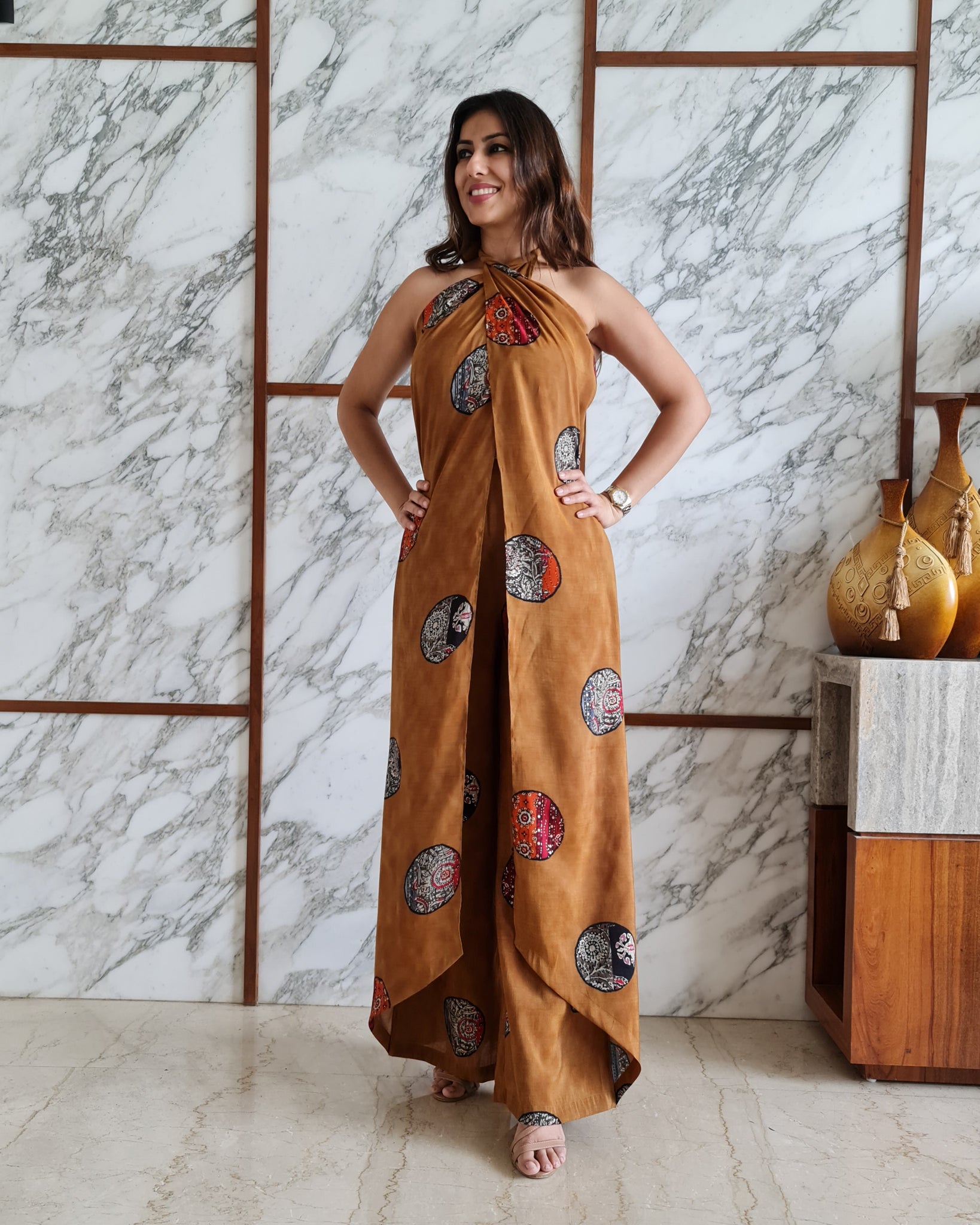 MUSTARD PRINTED HALTER NECK FLARED JUMPSUIT