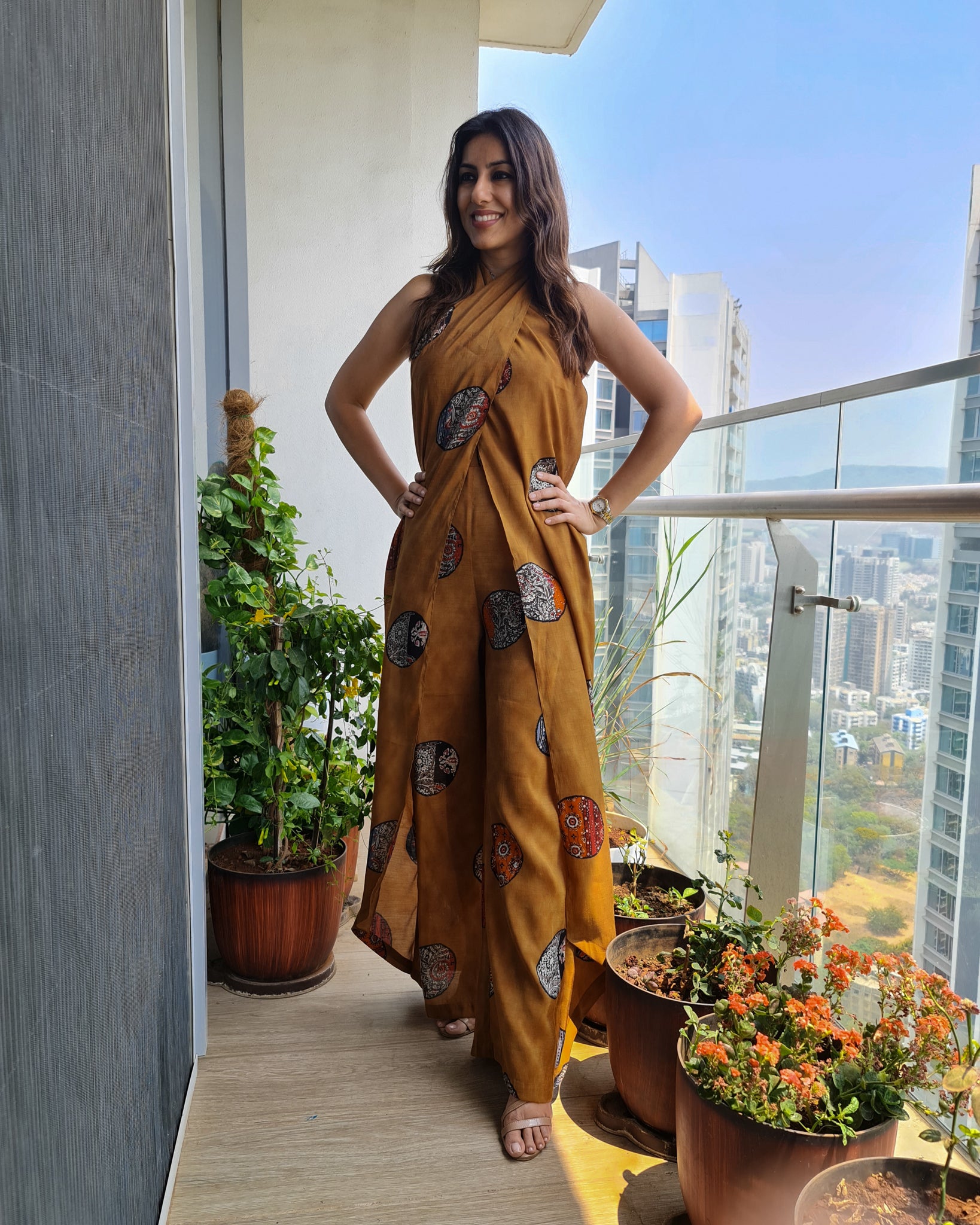 MUSTARD PRINTED HALTER NECK FLARED JUMPSUIT