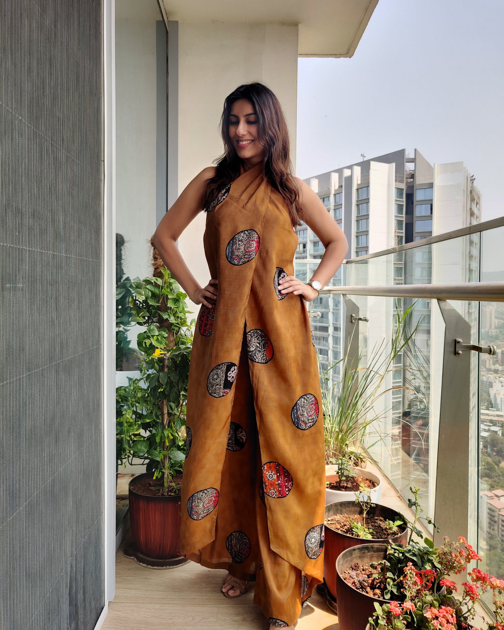 MUSTARD PRINTED HALTER NECK FLARED JUMPSUIT